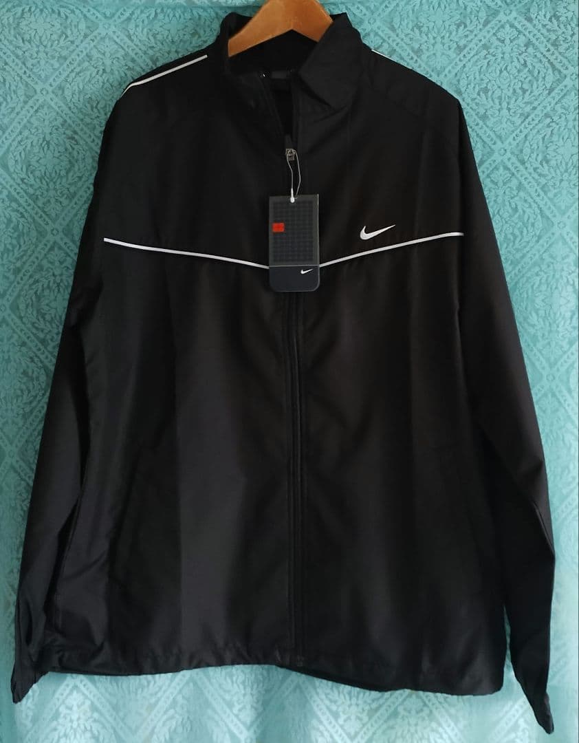 新品レディース Nike 上下セット上着 L サイズ 　パンツ M サイズ