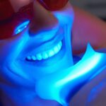 An image depicting the teeth whitening process, highlighting the benefits and potential side effects for a brighter smile.